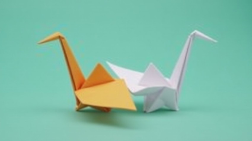 Origami Crane Symbolizing Hope and Unity in Contrasting Colors