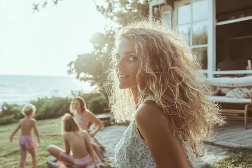 Family Relaxing at a Beach House Backyard