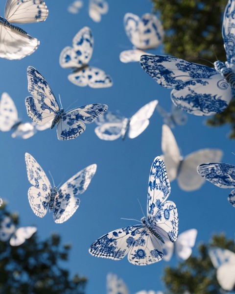 Porcelain Pattern Butterflies in Blue Sky with Sunlight